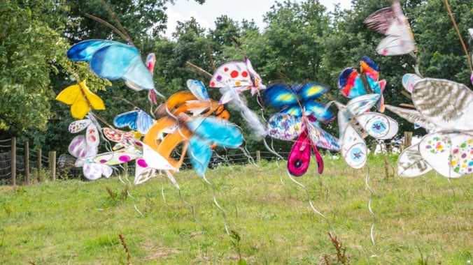 A community art installation made up of many colourful butterflies